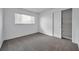 White bedroom featuring carpet and a closet with shelving at 6818 123Rd Ave, Largo, FL 33773