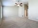Spacious bedroom featuring neutral walls, carpeted floor and a ceiling fan at 7541 Mariners Harbour Dr, Wesley Chapel, FL 33545