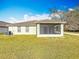 Home exterior featuring a screened patio at 7541 Mariners Harbour Dr, Wesley Chapel, FL 33545