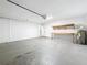 Spacious two car garage with shelving at 7541 Mariners Harbour Dr, Wesley Chapel, FL 33545