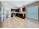 Charming kitchen features granite countertops, stainless steel appliances, and tiled floors at 7541 Mariners Harbour Dr, Wesley Chapel, FL 33545