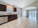 Modern kitchen with stainless steel appliances, granite countertops, and tile flooring at 7541 Mariners Harbour Dr, Wesley Chapel, FL 33545