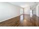Bright living room with beautiful hardwood flooring, chandelier, and large window at 7541 Mariners Harbour Dr, Wesley Chapel, FL 33545