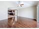 Bright living room with hardwood floors that connects to the kitchen at 7541 Mariners Harbour Dr, Wesley Chapel, FL 33545