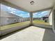 Screened patio with views of the fenced yard at 7541 Mariners Harbour Dr, Wesley Chapel, FL 33545