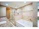 Modern bathroom featuring a glass shower, soaking tub, and granite countertops at 822 W Kirby St, Tampa, FL 33604