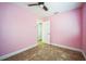 Bedroom with tile floors, ceiling fan and neutral trim at 822 W Kirby St, Tampa, FL 33604