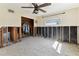 Bare bedroom with a ceiling fan, one window, black mold in the walls, and an open closet at 921 39Th Ne Ave, St Petersburg, FL 33703