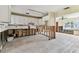 Kitchen featuring white cabinetry, offering space and an open layout to an adjacent living area at 921 39Th Ne Ave, St Petersburg, FL 33703