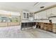 Bright kitchen with white cabinets, offering space and charm with an open flow to a sunlit nook at 921 39Th Ne Ave, St Petersburg, FL 33703