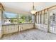 Bright sunroom featuring large windows, framing and flooring awaiting transformation into a cozy retreat at 921 39Th Ne Ave, St Petersburg, FL 33703
