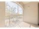 Outdoor balcony with a railing featuring views of trees and sky at 13304 Sanctuary Cove Dr # 303, Temple Terrace, FL 33637