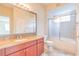 Bathroom with vanity, granite countertop, and tub/shower combo, offering functionality and style at 13304 Sanctuary Cove Dr # 303, Temple Terrace, FL 33637
