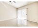 Bedroom featuring tile floors, ceiling fan, and sliding glass door at 13304 Sanctuary Cove Dr # 303, Temple Terrace, FL 33637