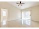 Bedroom featuring tile floors, ceiling fan, and sliding glass door at 13304 Sanctuary Cove Dr # 303, Temple Terrace, FL 33637