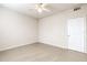 Spacious bedroom featuring tile flooring, ceiling fan, and a closet at 13304 Sanctuary Cove Dr # 303, Temple Terrace, FL 33637