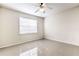 Neutral bedroom with tile floors, a ceiling fan, and bright window at 13304 Sanctuary Cove Dr # 303, Temple Terrace, FL 33637