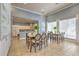 Bright dining area features tile flooring, natural light, and two dining tables for entertaining at 13304 Sanctuary Cove Dr # 303, Temple Terrace, FL 33637