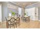 Bright dining area features tile flooring, natural light, and two dining tables for entertaining at 13304 Sanctuary Cove Dr # 303, Temple Terrace, FL 33637