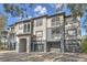 Condominium exterior with attached garages, balconies, and stucco walls at 13304 Sanctuary Cove Dr # 303, Temple Terrace, FL 33637