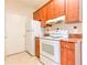 Kitchen area featuring wooden cabinets, and appliances at 13304 Sanctuary Cove Dr # 303, Temple Terrace, FL 33637