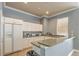 Bright kitchen area features ample cabinet space, modern appliances, and plenty of counter space at 13304 Sanctuary Cove Dr # 303, Temple Terrace, FL 33637