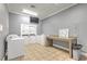 Spacious laundry room includes multiple washers/dryers and folding table at 13304 Sanctuary Cove Dr # 303, Temple Terrace, FL 33637