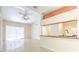 Living area with tile flooring, ceiling fan, and sliding glass door at 13304 Sanctuary Cove Dr # 303, Temple Terrace, FL 33637