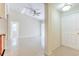 Living area with tile flooring, ceiling fan, and interior door at 13304 Sanctuary Cove Dr # 303, Temple Terrace, FL 33637