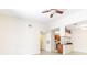 Living area with tile flooring, ceiling fan, and view of the kitchen at 13304 Sanctuary Cove Dr # 303, Temple Terrace, FL 33637