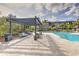 Inviting pool deck with shaded lounge area offers a great space to relax outdoors at 13304 Sanctuary Cove Dr # 303, Temple Terrace, FL 33637