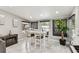 Bright dining area features a high-top table with seating for six and a decorative fireplace at 10103 N Ashley St, Tampa, FL 33612