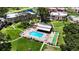 Aerial view of the community pool, bocce ball court, and common green space at 110 Aspen Cir, Seminole, FL 33777