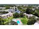 Aerial shot of community featuring swimming pool, lake, and manicured grounds at 110 Aspen Cir, Seminole, FL 33777