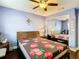 Cozy bedroom with ample closet space, a ceiling fan, and charming decor at 110 Aspen Cir, Seminole, FL 33777