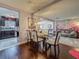 Open dining room with a modern chandelier flowing into the spacious living area and bright kitchen at 110 Aspen Cir, Seminole, FL 33777