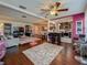 Open living space seamlessly connecting modern kitchen, dining area, and a cozy seating area at 110 Aspen Cir, Seminole, FL 33777
