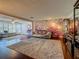 Expansive living area combines modern living, dining, and den in one connected open space at 110 Aspen Cir, Seminole, FL 33777