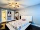 Contemporary bedroom with modern bed frame, stylish lighting, and ensuite bathroom at 110 Aspen Cir, Seminole, FL 33777