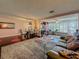 Bright open concept living space featuring dining, kitchen and den areas with stylish decor at 110 Aspen Cir, Seminole, FL 33777