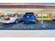 Designated parking spot with two cars parked under the covered car port area at 110 Aspen Cir, Seminole, FL 33777