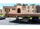 Covered parking area with parking spots and view of the home's exterior at 110 Aspen Cir, Seminole, FL 33777