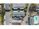 Bird's eye view showcases building rooftops, a parking area, and a refreshing community pool at 1142 84Th N Ter # C, St Petersburg, FL 33702