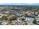 Extensive aerial view of a neighborhood highlighting tree coverage and varied housing complexes at 1142 84Th N Ter # C, St Petersburg, FL 33702