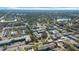 Expansive neighborhood aerial, featuring green landscapes, dense housing, and community amenities at 1142 84Th N Ter # C, St Petersburg, FL 33702