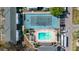Overhead view of a community pool and tennis courts surrounded by residential buildings at 1142 84Th N Ter # C, St Petersburg, FL 33702