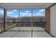 Balcony with metal railing, brick exterior, and view of a nearby building at 1142 84Th N Ter # C, St Petersburg, FL 33702