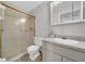 Bathroom with a glass shower, vanity, and neutral tile flooring at 1142 84Th N Ter # C, St Petersburg, FL 33702