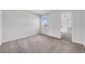 Neutral bedroom featuring carpet, a bright window, and a mirrored closet in a home for sale at 1142 84Th N Ter # C, St Petersburg, FL 33702