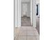 Neutral hallway showing transition between tile and carpet at 1142 84Th N Ter # C, St Petersburg, FL 33702